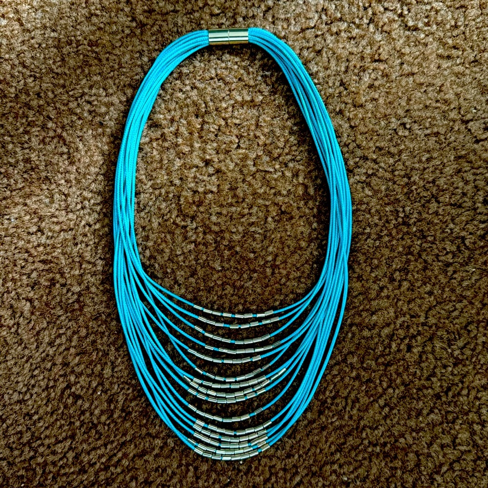 NWOT - Teal necklace with gold accents. Magnetic closure.